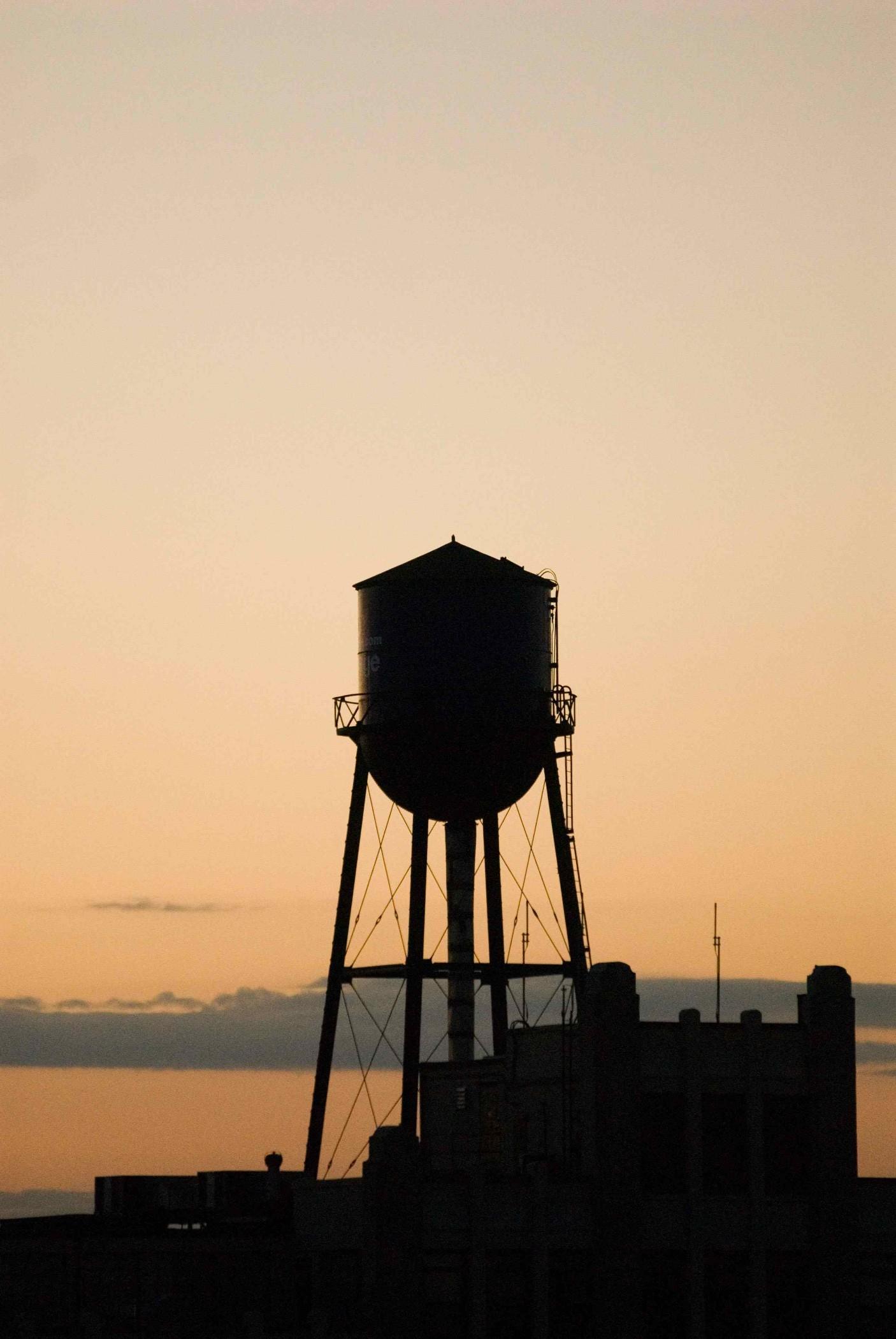 Sixty Soho Hotel New York Exterior photo Water tower at sunset